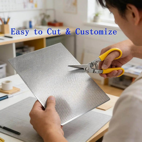 Person cutting Durable 304 Stainless Steel Perforated Sheet with 0.06 inch holes and 0.02 inch thickness measures 9.5 inches wide.