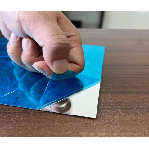 Peeling protective film off 430 Stainless Steel Magnetic Mounting Plates 12 x 6 Inches 0.5mm Thick Mirror Finish for Kitchens and Offices