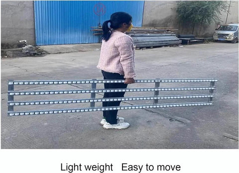 Person carrying Stainless Steel Roller Conveyor Belt For Light Duty Gravity Conveyor Table with ABS Plastic Rollers outdoors.