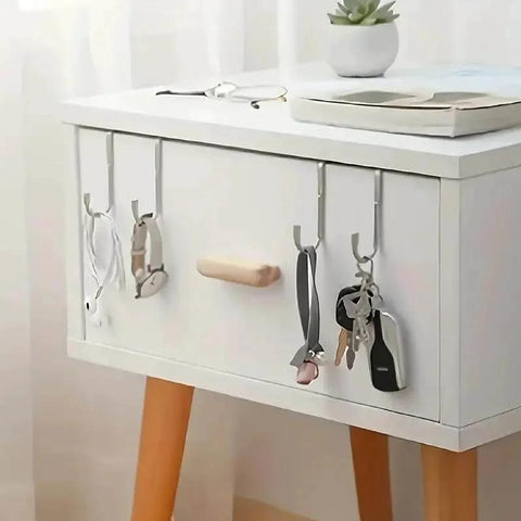 Two Pack Stainless Steel S Hooks No Drill Multipurpose Hanging Hooks holding keys and accessories on a white cabinet