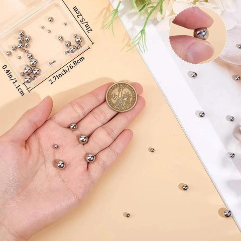 Hand holding 5 Size Set Of Screw Ball Backings For Threaded Posts 304 Stainless Steel Round Earring Backs with measurement guide