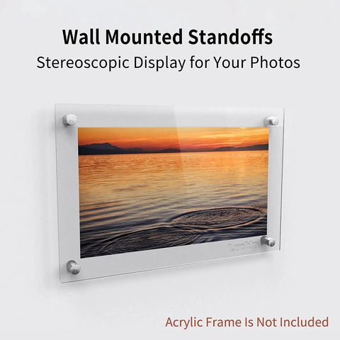 Wall-mounted standoff screws displaying sunset photo without acrylic frame included.