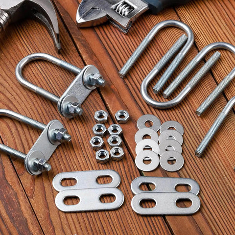 Durable stainless steel U bolts kit with 6 bolts, plate, 12 nuts and washers laid out on wooden surface