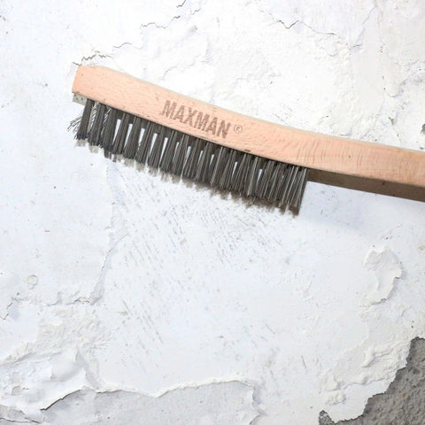 Wire Brush, Heavy Duty Stainless Steel Wire Brushes for Cleaning Rust, with 14" Beech Handle shown removing paint from wall surface.