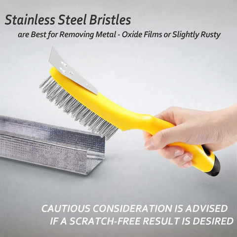 Hand holding stainless steel wire brush with metal scraper, plastic contoured handle, 79 bristle bundles, for metal cleaning.