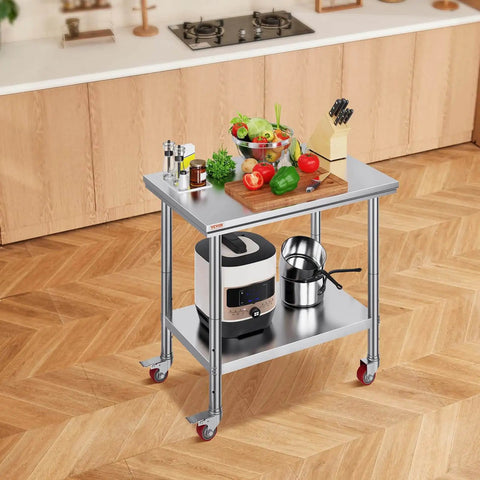 Heavy Duty Stainless Steel Work Table With Four Rolling Casters 36 By 24 Inches Commercial Kitchen Food Prep Station For Restaurant Use Easy To Clean Durable Silver with utensils and vegetables on top in a kitchen setting.