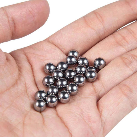 Steel balls held in hand, components for ✝️ 600-Pack Utility Cart Steel Frame Built for Moving Boxes, Appliances, and Heavy Cargo.