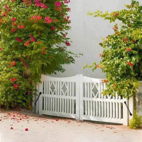 Heavy Duty 11 Inch Gate Spring Self Closing Black Steel Outdoor Gate Closer on white wooden fence in garden