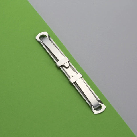 Prong Paper Fasteners For File Folders With 1 Inch Capacity And 2.75 Inch Base Box Of 50 Complete Two Piece Sets on green folder