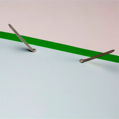 Prong Fastener Bases For Officemate OIC99854, silver finish, installed in paper showing two and three quarters inch center to center.