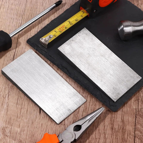 2 Pack Flange Wedge Set 4x2 Inch Beveled Right Angle Steel Wedges on wooden table with tools