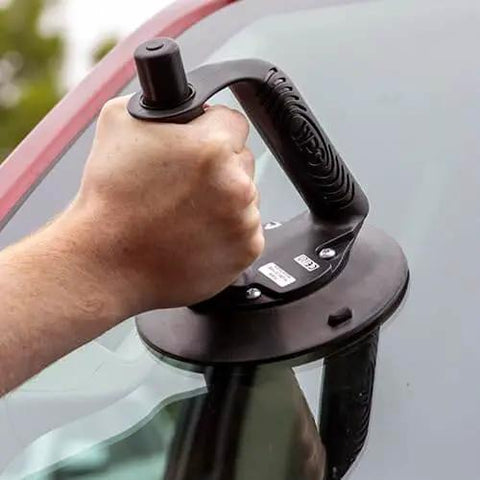 Two Piece Beefy Angle Grip 6 Inch Vacuum Suction Cup for auto glass handling with powerful suction shown lifting windshield