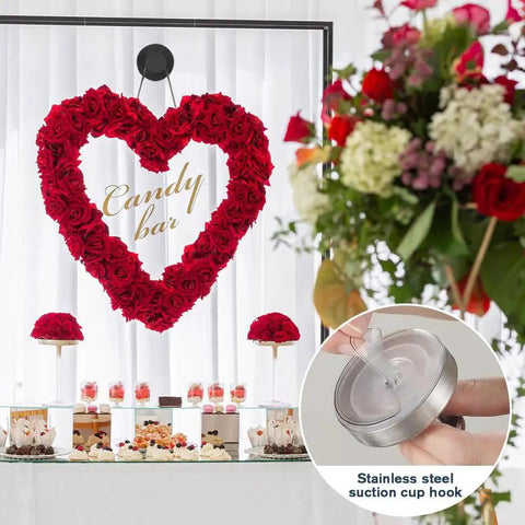 Golden Suction Cup Hooks For Glass And Tile Surfaces No Drill Wreath Hanger showing a red heart wreath on glass with stainless steel hook.