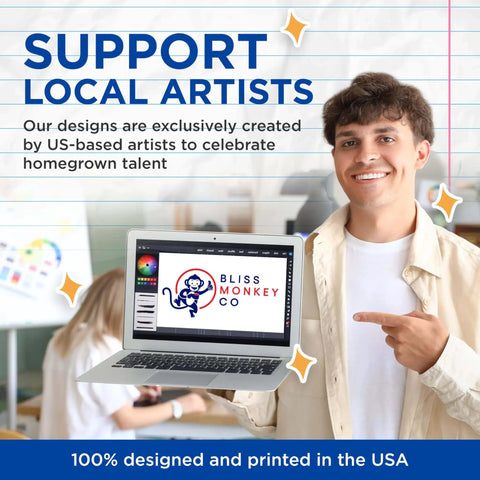 Person holding a laptop displaying Bliss Monkey Co. logo; sign supporting local artists, emphasizing US-based design and printing.