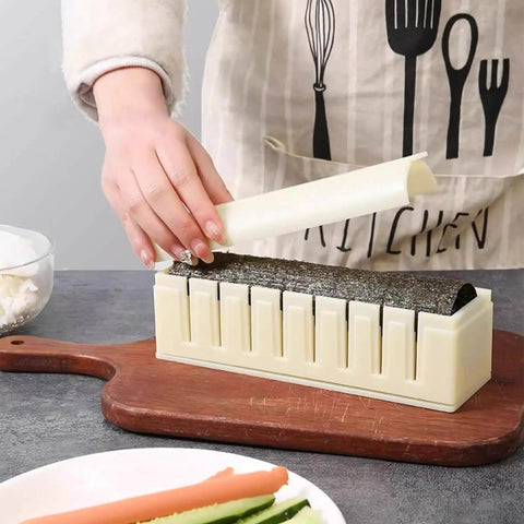 Using Complete Sushi Making Kit With 3 Shape Molds Rice Roller Tool And Spatula for restaurant-style sushi at home.