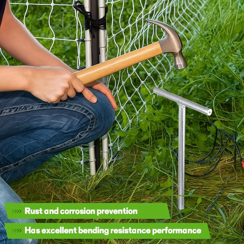 Installing 2 Pack 36 Inch T Handle Galvanized Ground Rod with hammer near electric fence, for industrial power setups and chemical industry use.