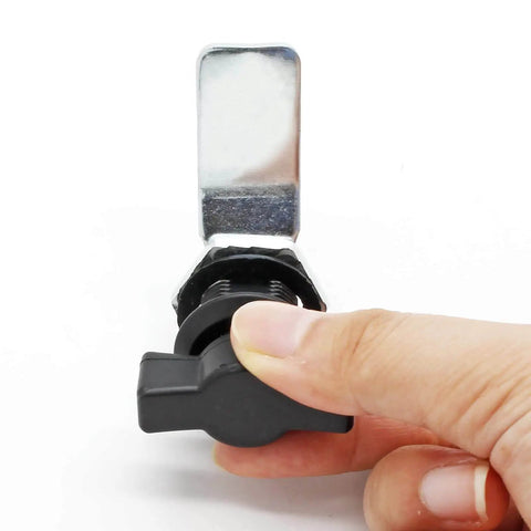 Front view of two piece thumb operated offset cam lock set with durable rust resistant zinc alloy construction, finger operating the lock.
