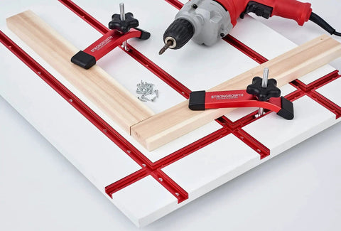 Heavy Duty T Track Hold Down Clamps For Woodworking 6 3/8 Inch Long 1 1/4 Inch Wide installed on a table with a drill