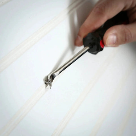Heavy Duty Tack Lifter For Carpet Tacks And Small Nails With Chrome Vanadium Steel Shank and Rust Plating in use on skirting board