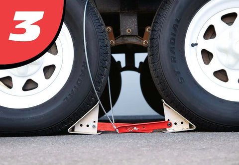 OneStep Wheel Chock Double Pack For Tandem Axle Trailers And RVs, 16 To 24 Inch Long, installed between tires for stability