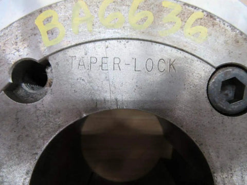 Top view of Heavy Duty Taper Lock Hub Two Seven Eighths Inch Stainless Steel For Rexnord 70 HTI STI 7300780 With One Half Inch By Three Quarter Inch Keyway One Quarter Inch Npt Nine And A Quarter Inch Outer Diameter Three And A Half Inch Thick Power Transmission showing the taper-lock engraving.