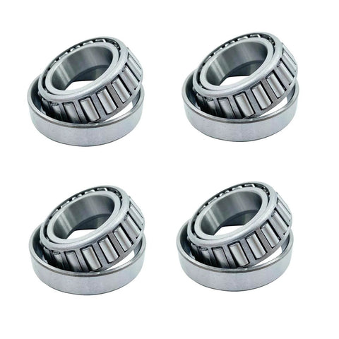 Four LM67048 LM67010, ID 1.250" x OD 2.328" SET6 tapered roller bearings arranged on a white background