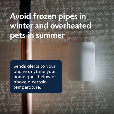 SimpliSafe temperature sensor on wall, white plastic housing for hot and cold detection.