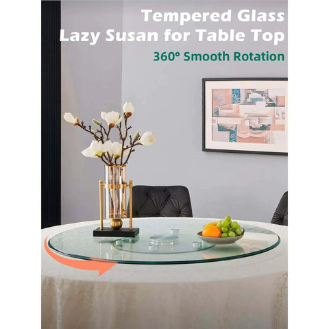 22.8 inch tempered glass lazy susan rotating serving tray on a dining table with flowers and fruits for easy serving.