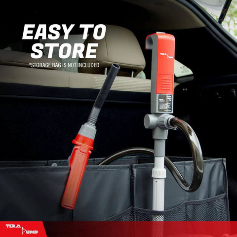 TERA PUMP Portable Battery Powered Gas Transfer Pump stored in car trunk with nozzle and adjustable intake visible