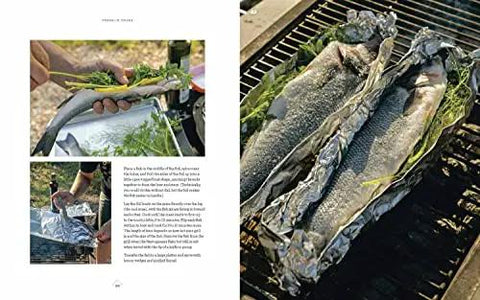 Texas Style Live Fire Grilling And Smoking At Home A Cookbook From The James Beard Award Winning Team Behind Franklin Smoke Wood Fire Food Packed With Pro Tips For Meats Veggies Fish And More open page showing grilled fish wrapped in foil with herbs