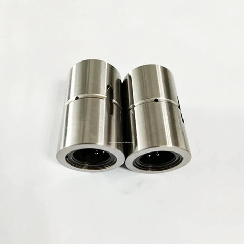 Pair of THK Ball Spline Nut LT 16 LT16UU for CNC axis motion, anti-backlash setup, shown close-up on white background.