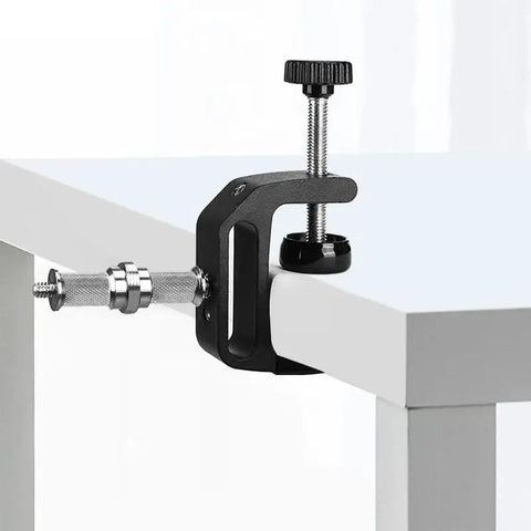 Three Piece Knurled One Quarter To Three Eighths Inch Metal Male Converter Screw Adapter attached to table edge