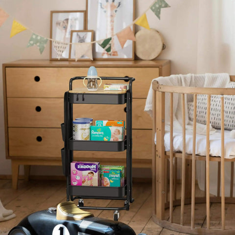 Black three-tier metal utility rolling cart with tabletop, side bags, mesh trays, storage organizers, hooks, in nursery