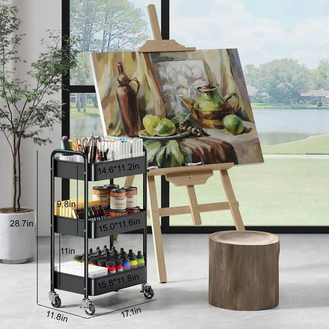 Three Tier Rolling Cart On Wheels, Heavy Duty Metal Utility Trolley With Lockable Wheels next to an art easel