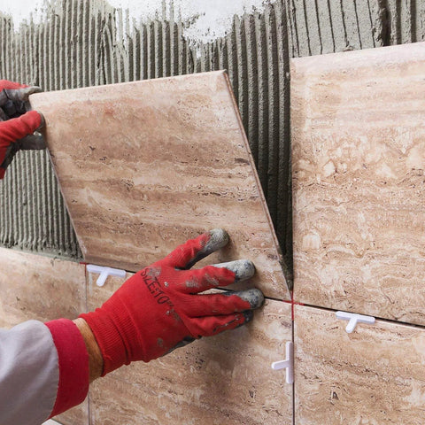 Installing tiles with 500 Piece Wide Tile Spacers And Levelers Set For Ceramic Tile And Stone Installation, using cross-shaped spacers.