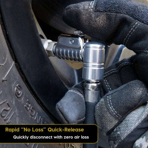Close-up of Lightning L2X Quick Connect Locking Tire Inflator Air Chuck Extension connected to a tire valve.