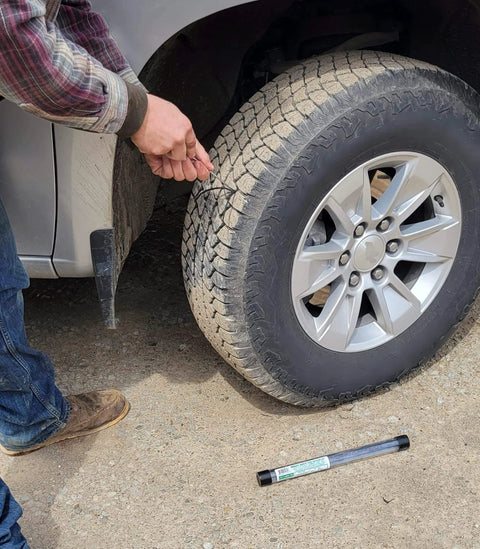 Person using 11-Piece Mini Tire Repair Kit All-In-One Fix A Flat For Car, Truck, Golf Cart, Lawn Mower, Motorcycle And ATV Made In USA.
