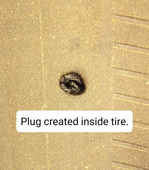 Close-up of tire with plug from Heavy Duty Tire Repair Kit 21-Piece All-In-One Tire Plug Kit for Car, Truck, Golf Cart, Lawn Mower, Motorcycle, Semi, Tractor and ATV Made in USA, Easy Insertion, Quick Plug, Long-Lasting Patch, On-The-Go Tire Fix. Plug shown sealed.