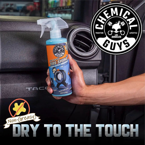 Hand holding 16 oz Tire Kicker Sprayable Extra Glossy Tire Shine Spray, restores wet look to rubber, vinyl, and plastic, dry to touch.