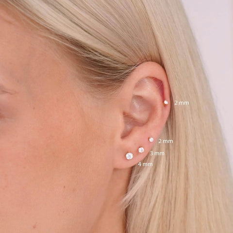 Side view of ear wearing ✝️ Titanium Earrings Screw Back Earrings for Women Toddler, Hypoallergenic Flat Back Stud Earrings Cubic Zirconia Studs (Gold, 2mm)