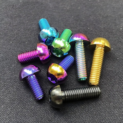 Set of colorful titanium bolts for MTB disc brake rotors; includes Set Of Twelve Titanium M5x10mm Rotor Bolts For MTB Mountain Bike Disc Brake Rotors Featuring Torx T25 Head Grade 5 Titanium 6Al-4V Lightweight Yet Strong Corrosion Resistant Black Finish For Reliable High Performance Braking.