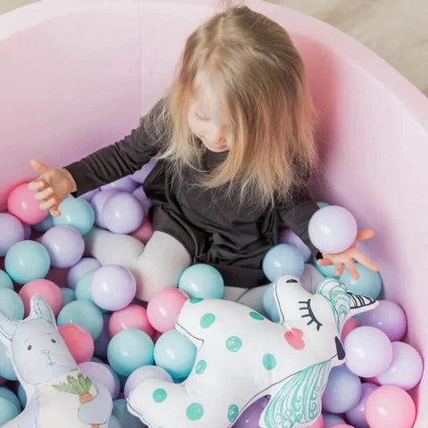 Toddler playing in a ball pit with pastel-colored balls, featuring 200 Count Plastic Soft Plastic Ball Pits Balls Colorful Play Pits Balls for Pet Dogs Ball Pits 2.2" Large Phthalate Free Bpa Free Balls for Toddlers 1-3 Baby Kids.