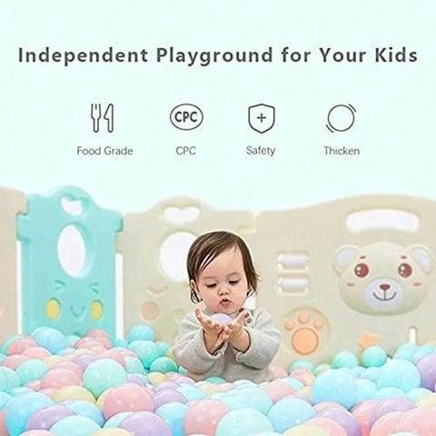Toddler playing with colorful ball pit balls in indoor play area, featuring "Independent Playground for Your Kids" text above.