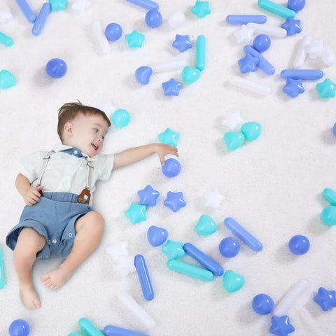 Toddler playing with Ball Pit Balls for Toddlers - Macaron Ball Pit Balls Crush Proof Plastic Toy Balls, 50pcs in blue, green, and white