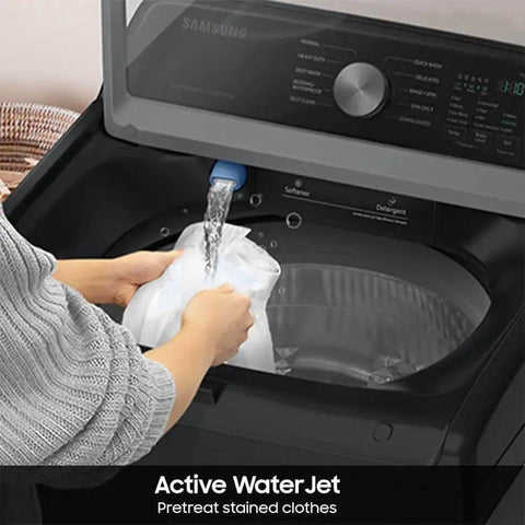 Smart Laundry Bundle With 4.7 Cu Ft Top Load Washer And 7.4 Cu Ft Electric Dryer WaterJet System Sensor Drying Prevents Overdrying Low Vibration Quiet Wash Includes Power Cords Hoses Vent Duct And 1 Year CPS Protection Black showing active WaterJet with hands placing clothes in washer.