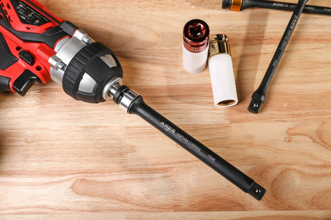 Foot/Pound Torque Limiting Extension Bar - Chrome Moly 1/2-Inch Drive 8-Inch Long Impact Grade Bar attached to a drill