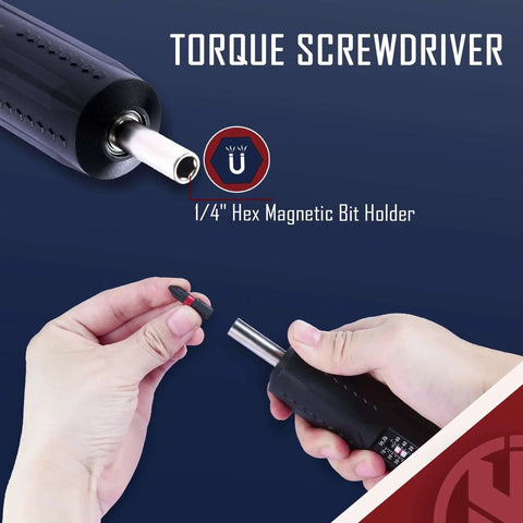 Hands holding a torque screwdriver wrench driver set with 1/4" hex magnetic bit holder, black handle, used for maintenance.