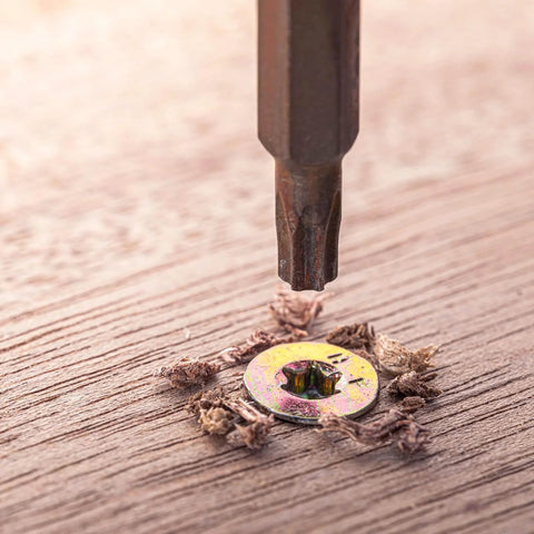 Close-up of M2-0.4 x 4mm Flat Torx Head Machine Screw installed in wood, featuring countersunk Torx anti-theft design.