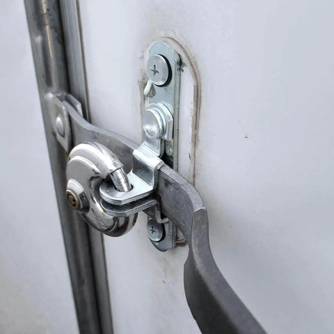 Close-up of Cargo Trailer Door Hasp Keeper Bar Lock Handle For Enclosed Car Hauler Ramp Gates Cam Latch Lock with screws and nut.