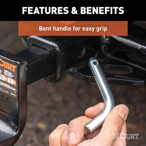 Hand holding Trailer Hitch Pin And Clip Half Inch Diameter Fits One And A Quarter Inch Receivers With Clear Zinc Finish Easy Grip